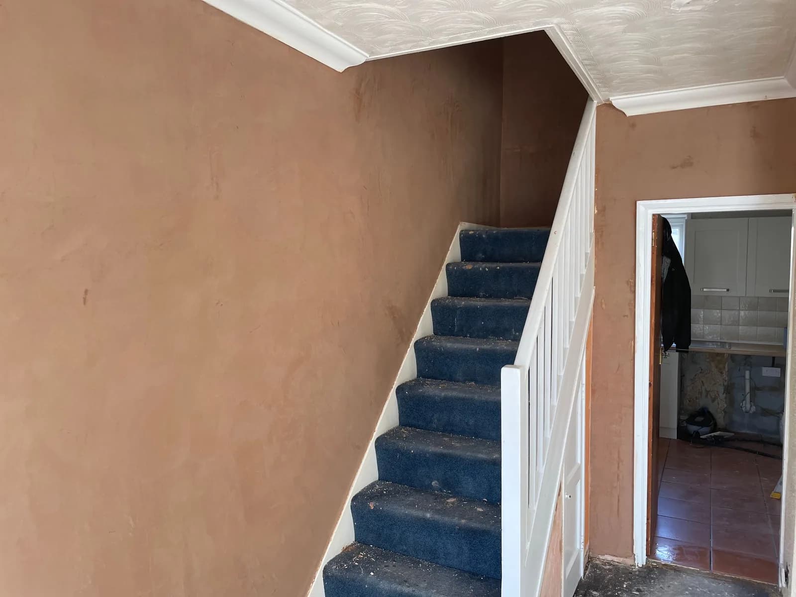 Re-plastered hallway and staircase walls